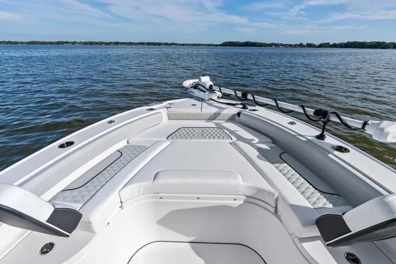 Slide: The Image of 2026 Blackfin 242 HB boat docked on calm water, showcasing sleek design and modern features. - 3
