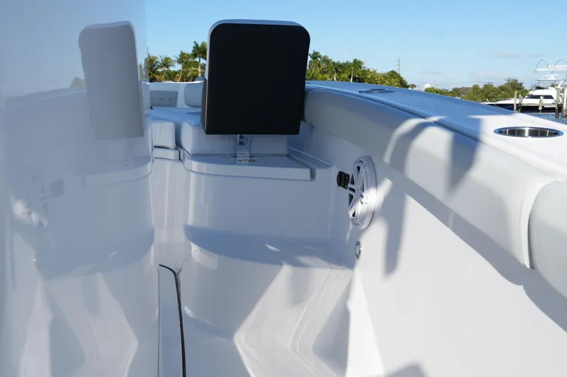 Slide: The Image of 2026 Blackfin 242 HB boat interior with sleek white design and speaker detail. - 30