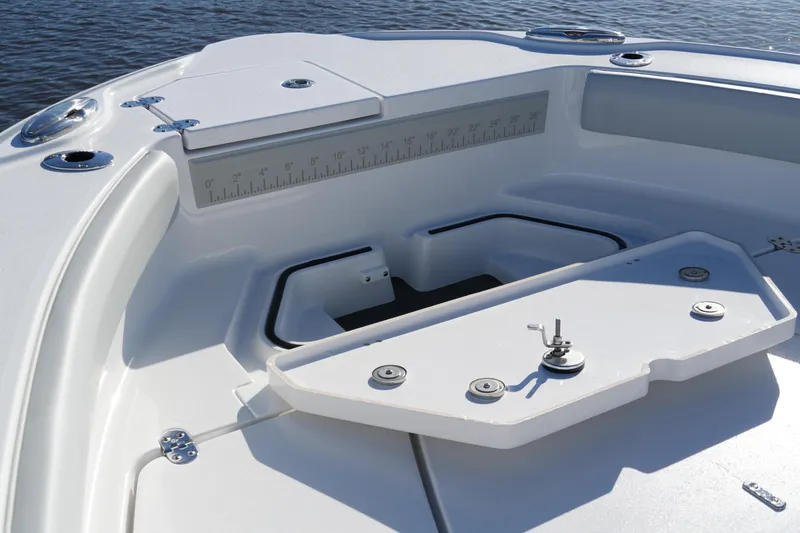 Slide: The Image of 2026 Blackfin 242 HB boat interior with storage compartments and measurement guide. - 35