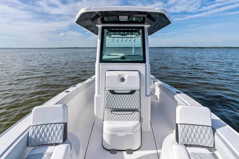 Slide: The Image of 2026 Blackfin 242 HB boat on water, featuring sleek design and modern amenities. - 4
