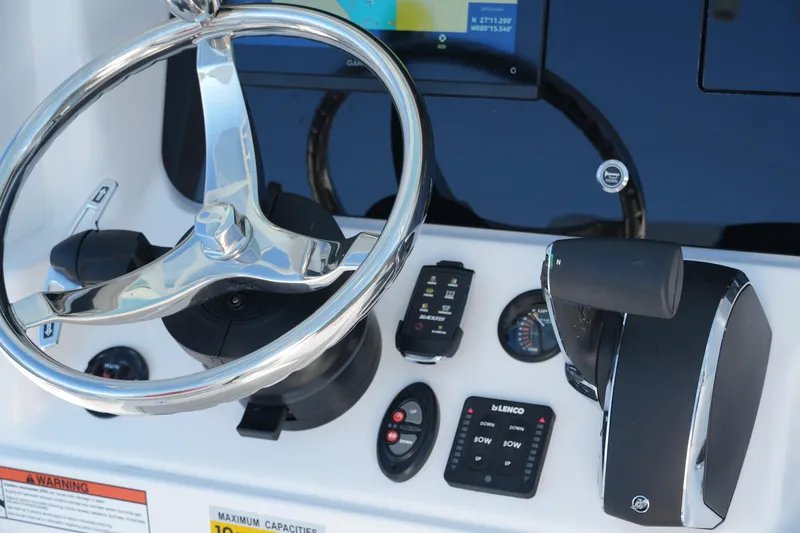 Slide: The Image of Steering console of 2026 Blackfin 242 HB boat with controls and gauges. - 40