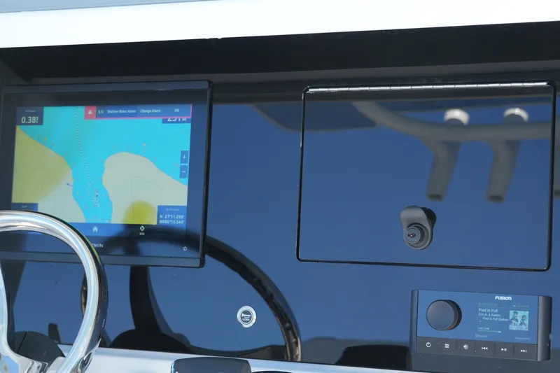 Slide: The Image of Dashboard of 2026 Blackfin 242 HB boat with navigation and audio controls. - 41