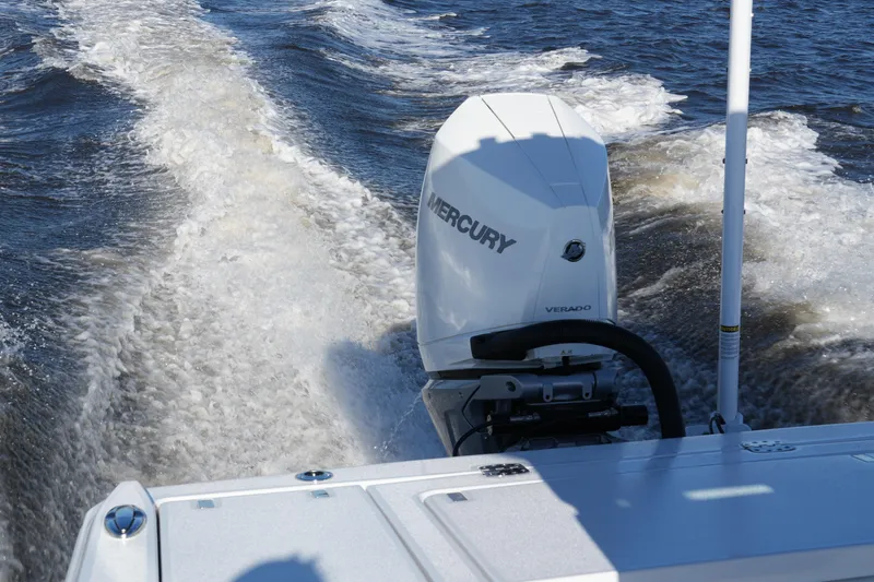 Slide: The Image of 2026 Blackfin 242 HB boat with Mercury Verado engine cruising on water. - 43