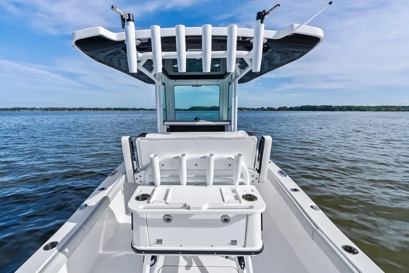 Slide: The Image of 2026 Blackfin 242 HB boat on water, featuring sleek design and Mercury engine. - 5