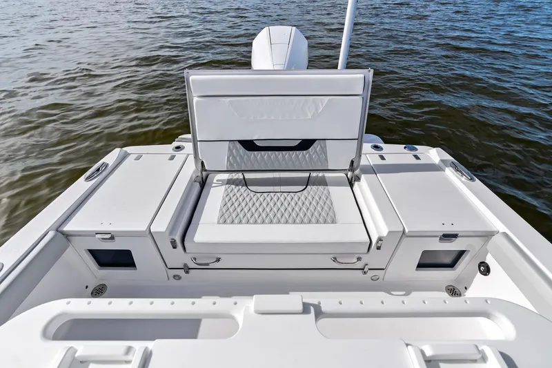 Slide: The Image of 2026 Blackfin 242 HB boat in marina, light blue hull, calm water, sunny day. - 6