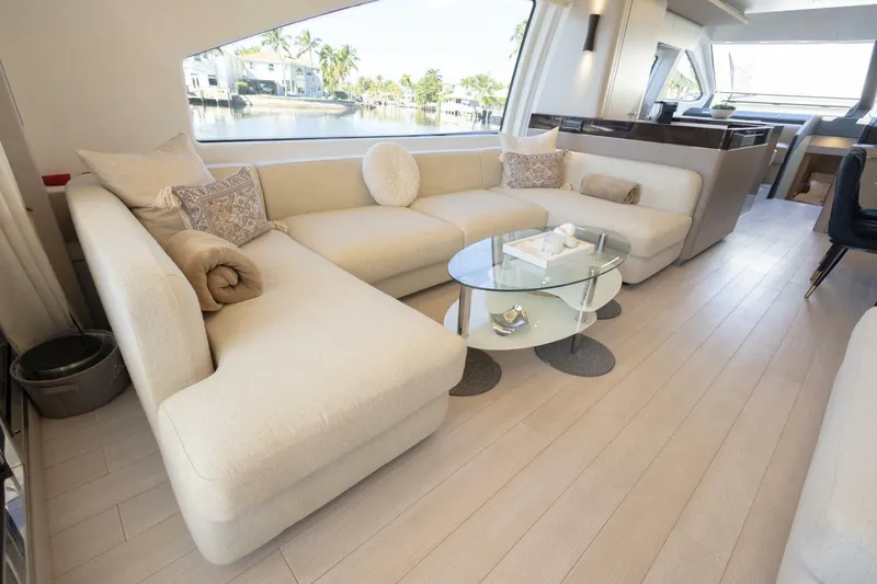 Slide: The Image of Luxurious interior of 2021 Azimut Fly 72 yacht with elegant seating and glass table. - 15