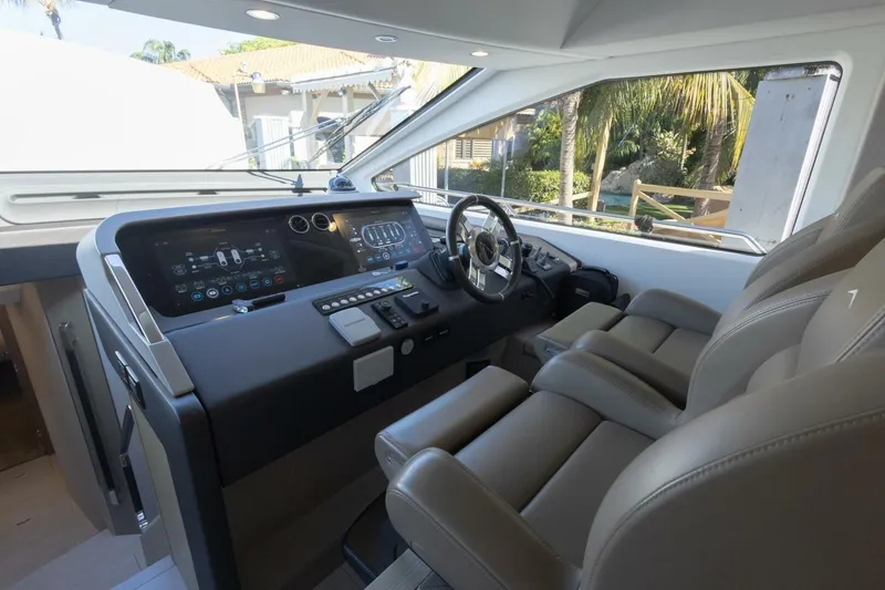 Slide: The Image of Luxurious interior of 2021 Azimut Fly 72 yacht with modern dashboard and leather seating. - 27