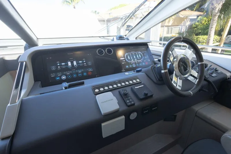Slide: The Image of Cockpit of 2021 Azimut Fly 72 yacht with modern navigation controls and steering wheel. - 29