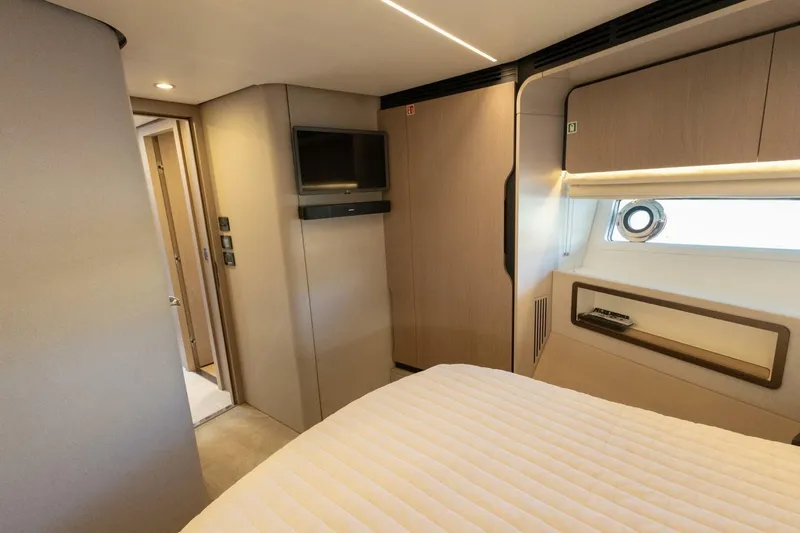 Slide: The Image of Interior of 2021 Azimut Fly 72 yacht bedroom with modern design and window view. - 40