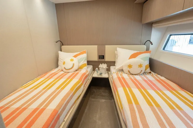 Slide: The Image of Interior of 2021 Azimut Fly 72 yacht with twin beds and colorful decor. - 46