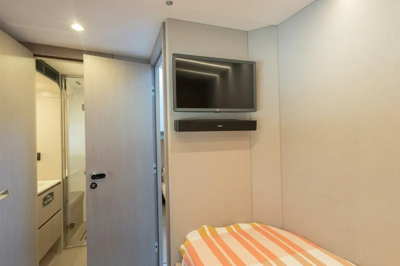 Slide: The Image of Interior cabin of 2021 Azimut Fly 72 yacht with TV and bed. - 47