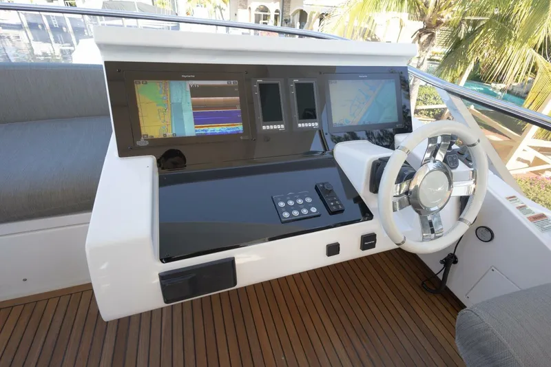 Slide: The Image of Cockpit of 2021 Azimut Fly 72 yacht with modern navigation displays and steering wheel. - 53