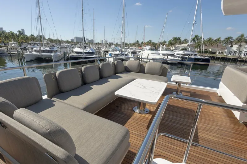 Slide: The Image of Luxurious seating area on 2021 Azimut Fly 72 yacht, docked at marina. - 57