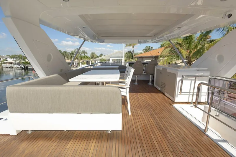 Slide: The Image of Luxurious 2021 Azimut Fly 72 yacht deck with elegant seating and wooden flooring. - 58