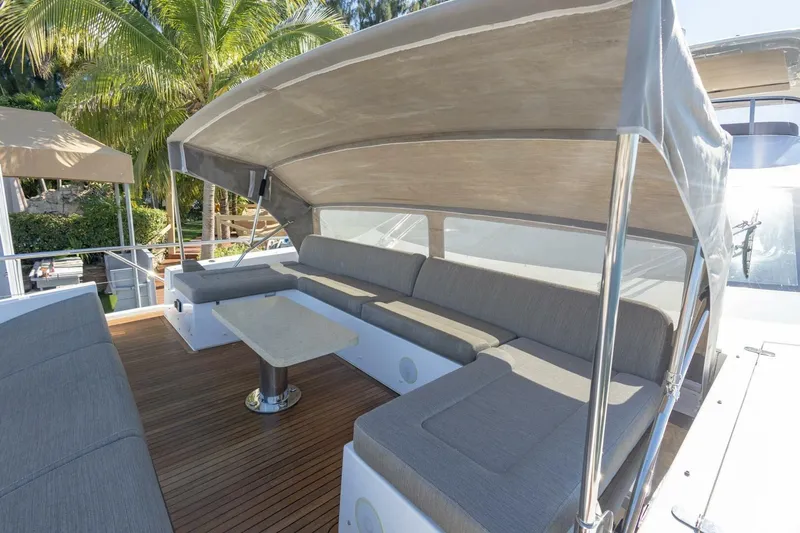 Slide: The Image of Luxurious 2021 Azimut Fly 72 yacht deck with shaded seating area. - 67