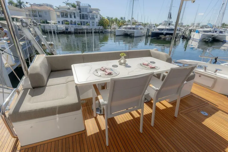 Slide: The Image of Luxury dining area on 2021 Azimut Fly 72 yacht, docked at marina. - 7
