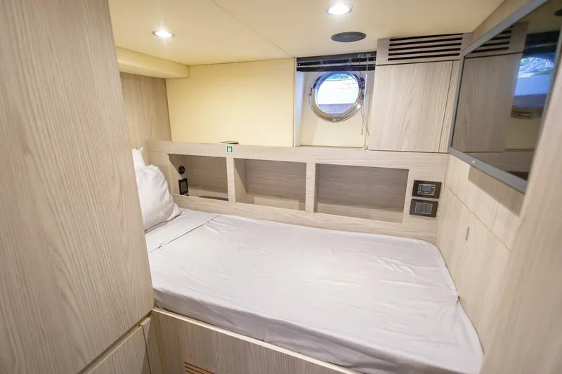 Slide: The Image of 2021 Azimut Fly 72 yacht cabin with modern design and porthole window. - 77
