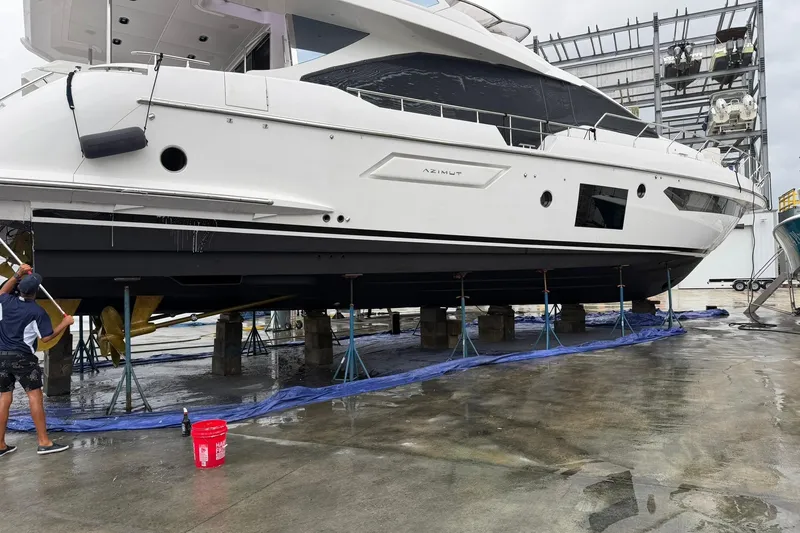 Slide: The Image of 2021 Azimut Fly 72 yacht undergoing maintenance in a shipyard. - 80