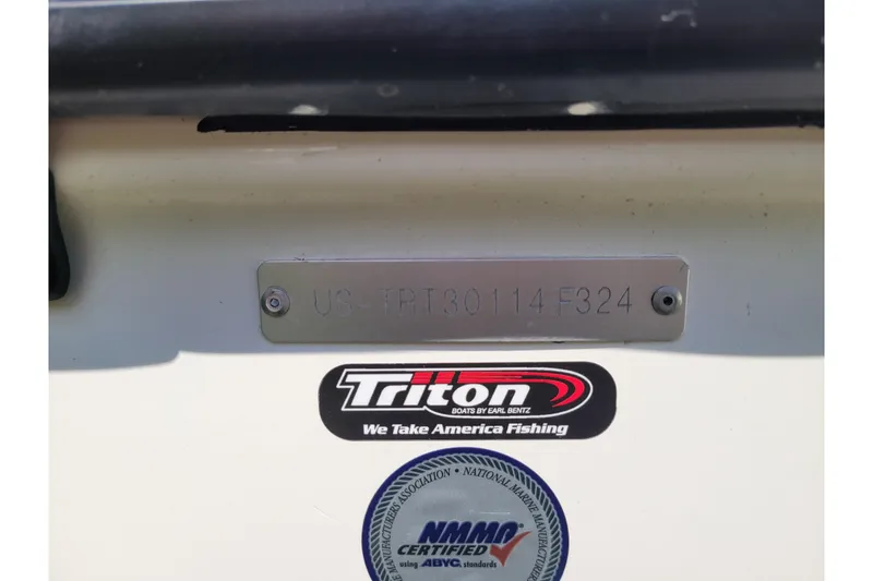 Slide: The Image of 2024 Triton 18 TrX boat with identification plate and certification stickers. - 16