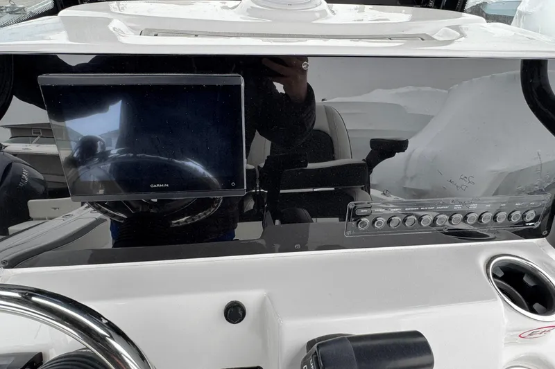 Slide: The Image of Dashboard of 2026 Tidewater 210 CC Adventure boat with Garmin display and control panel. - 10