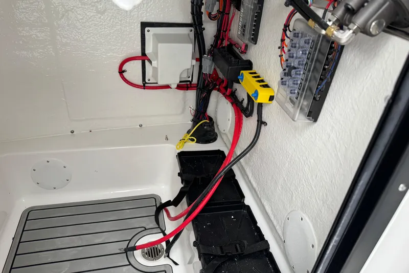 Slide: The Image of Interior wiring of 2026 Tidewater 210 CC Adventure boat, showcasing electrical components and connections. - 16