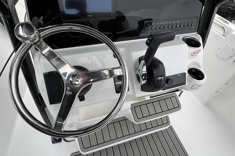 Slide: The Image of Steering console of 2026 Tidewater 210 CC Adventure boat with modern controls. - 9