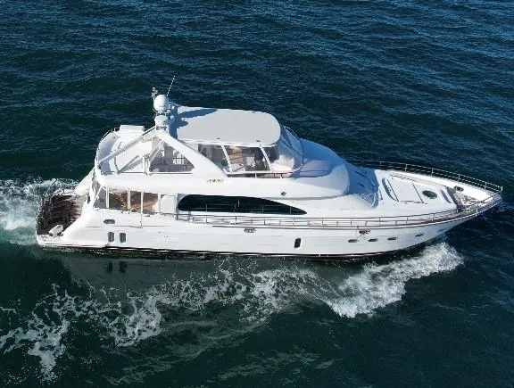 The Image of Luxurious 2004 Horizon P70 yacht cruising on open sea waters. - 0