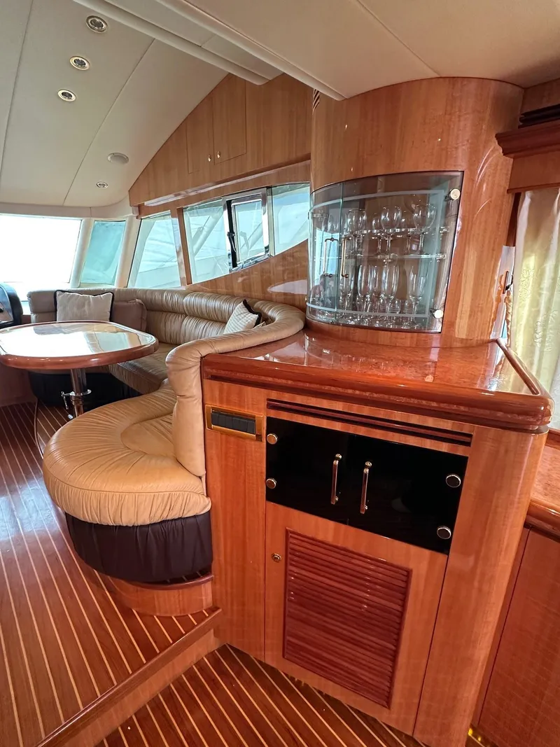 Slide: The Image of Luxurious 2004 Horizon P70 yacht interior with elegant wood finishes and comfortable seating. - 12