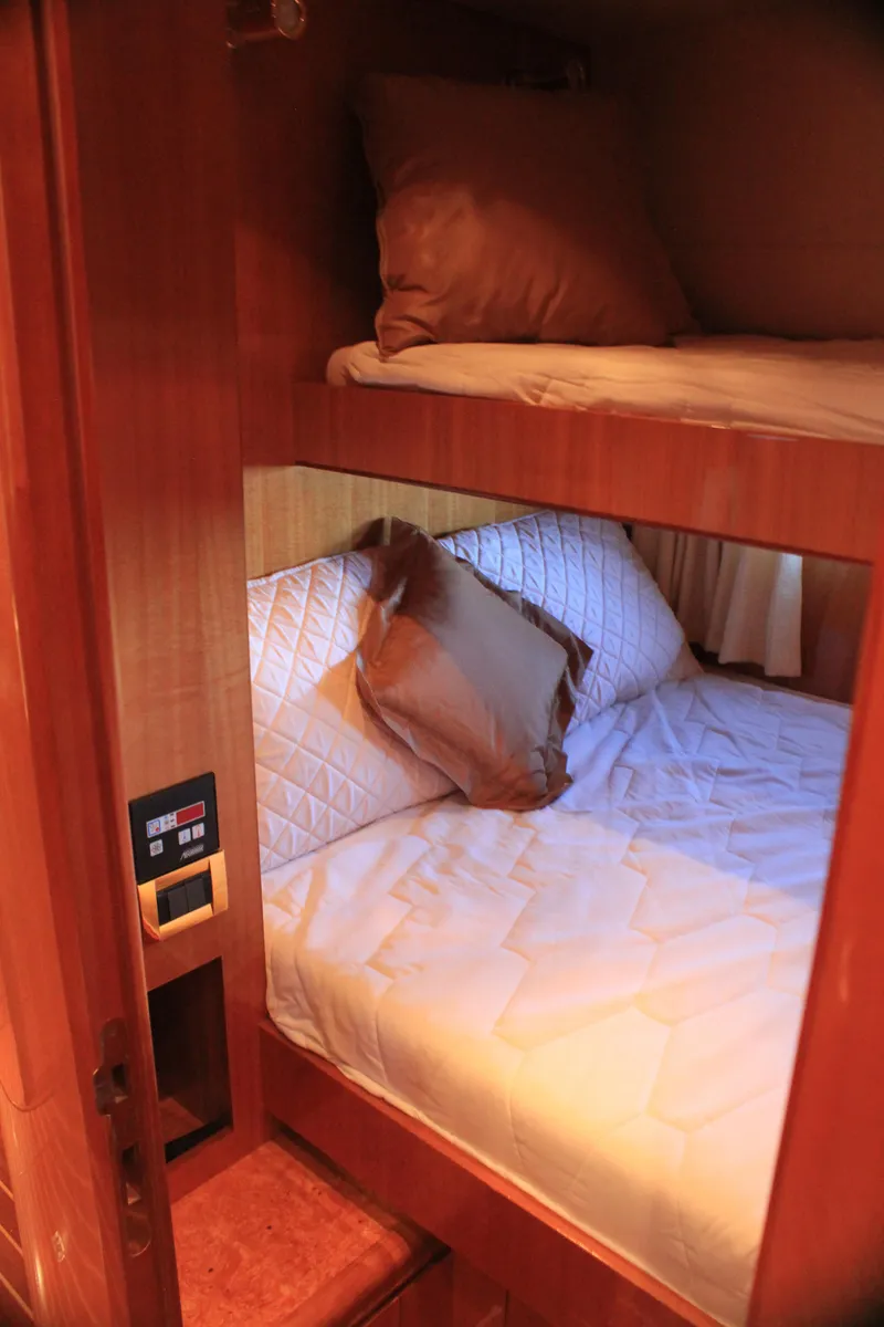 Slide: The Image of Cozy bunk beds in 2004 Horizon P70 yacht cabin. - 26