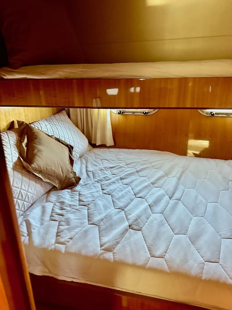Slide: The Image of Luxurious cabin interior of 2004 Horizon P70 yacht with cozy bedding. - 27