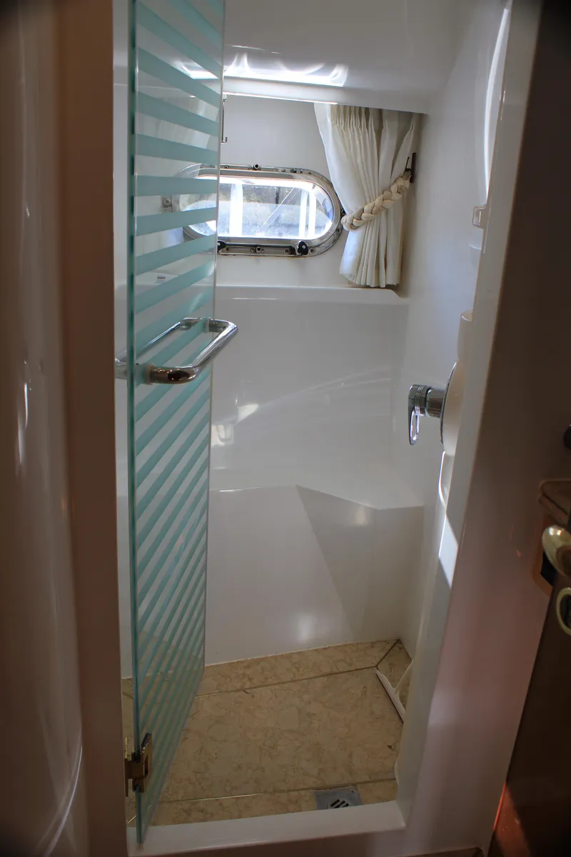 Slide: The Image of Compact bathroom with glass door in 2004 Horizon P70 yacht. - 28
