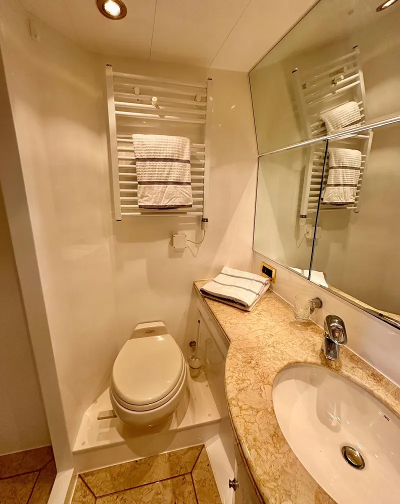 Slide: The Image of Luxurious bathroom in 2004 Horizon P70 yacht with elegant fixtures and marble countertop. - 36