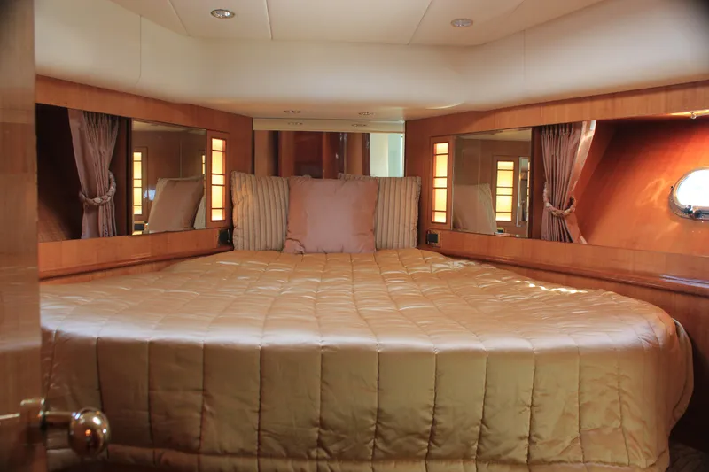 Slide: The Image of Luxurious bedroom interior of 2004 Horizon P70 yacht with elegant bedding and wood accents. - 37