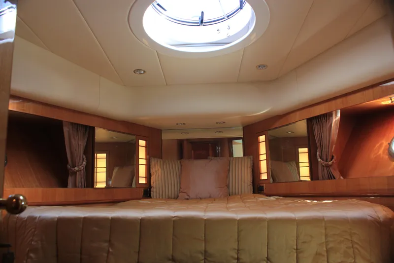 Slide: The Image of Luxurious cabin interior of 2004 Horizon P70 yacht with plush bedding and elegant lighting. - 38