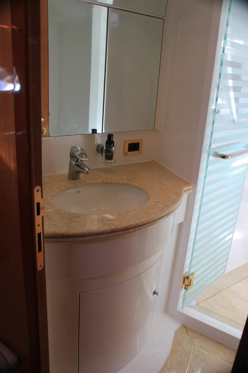 Slide: The Image of Luxurious bathroom in 2004 Horizon P70 yacht with marble countertop and glass shower. - 39