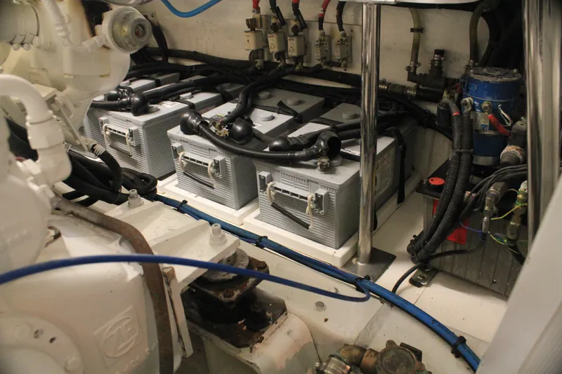 Slide: The Image of Engine room of 2004 Horizon P70 yacht with batteries and wiring. - 48