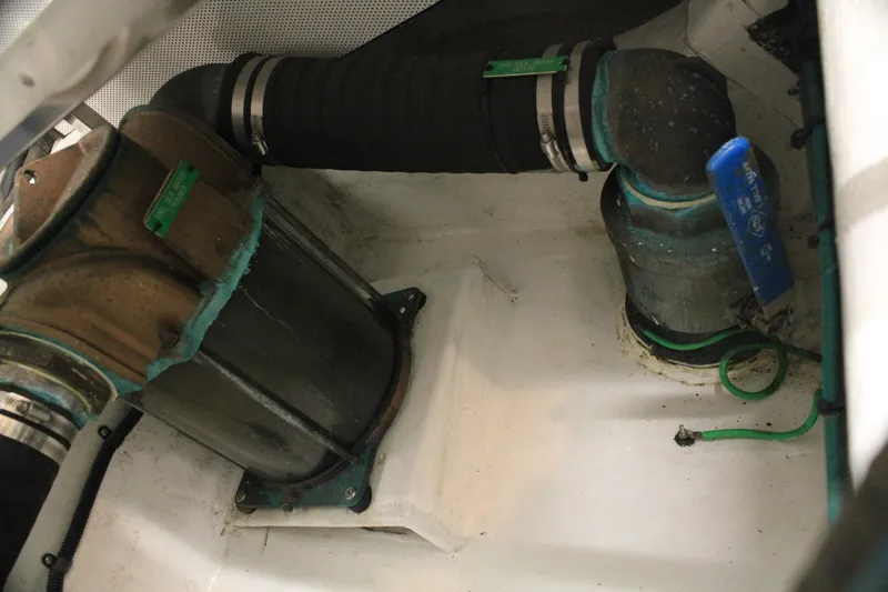 Slide: The Image of Engine compartment of a 2004 Horizon P70 yacht, showing hoses and fittings. - 50