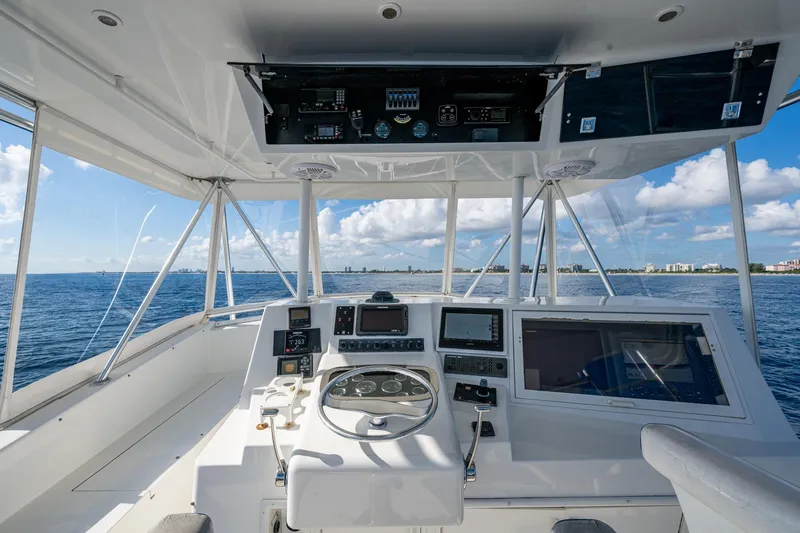 Slide: The Image of Helm of 1998 Viking 50 Convertible yacht with ocean view and navigation equipment. - 14