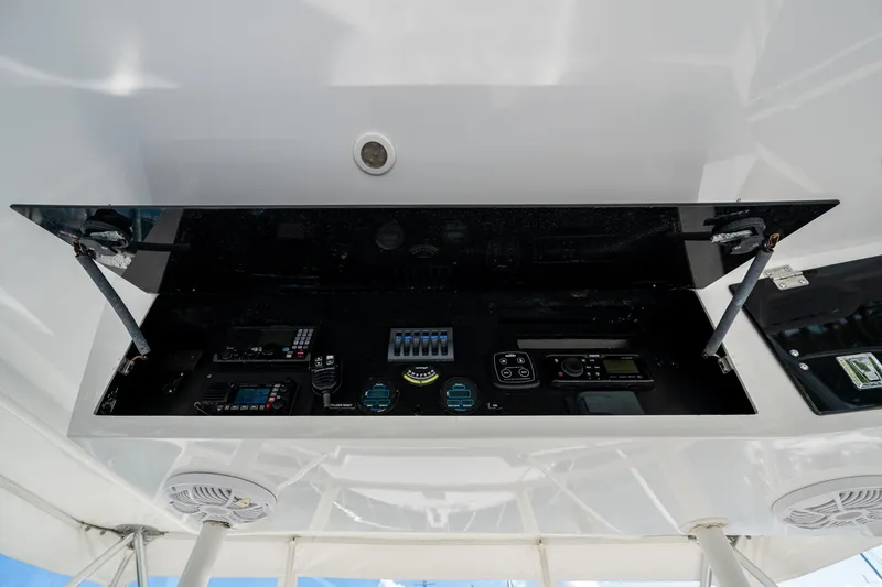 Slide: The Image of Control panel of a 1998 Viking 50 Convertible yacht, featuring various navigation instruments. - 17