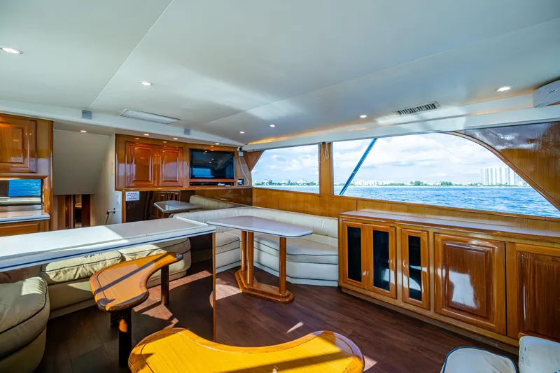 Slide: The Image of Luxurious interior of 1998 Viking 50 Convertible yacht with elegant wood finishes and ocean view. - 29
