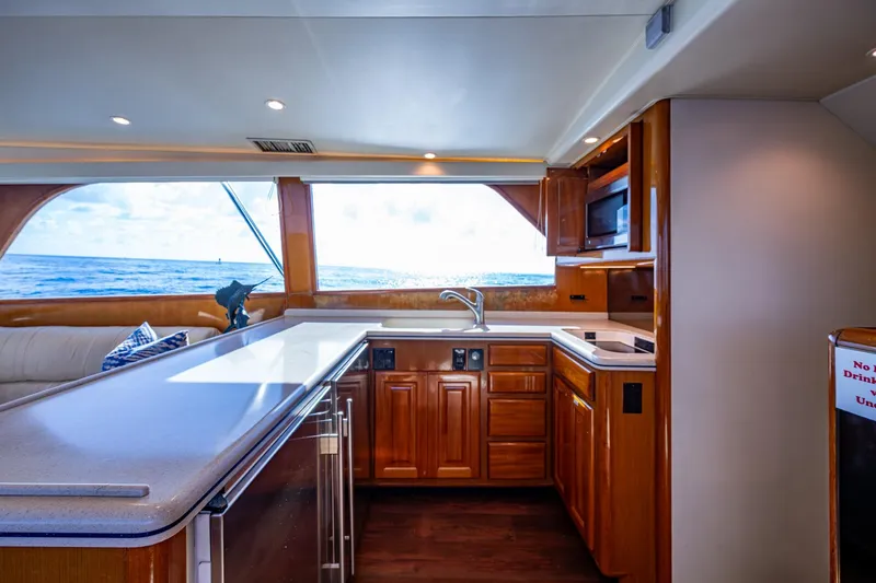 Slide: The Image of Luxurious kitchen interior of 1998 Viking 50 Convertible yacht with ocean view. - 33