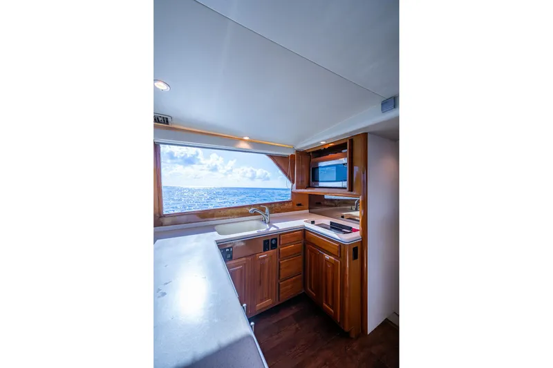 Slide: The Image of Interior of 1998 Viking 50 Convertible yacht kitchen with ocean view. - 35