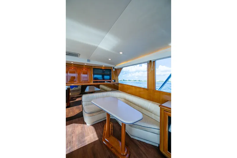 Slide: The Image of Interior of 1998 Viking 50 Convertible yacht with elegant seating and ocean view. - 36