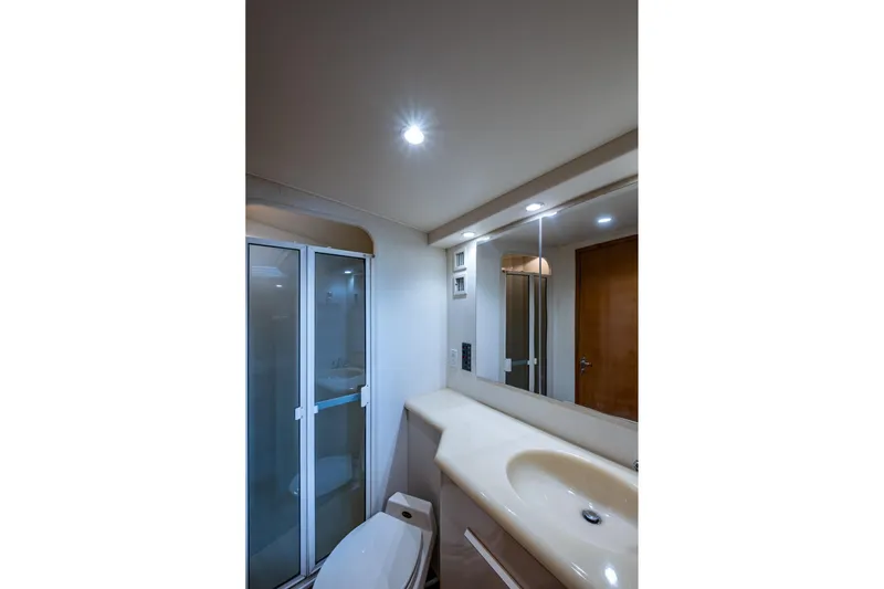 Slide: The Image of Bathroom interior of 1998 Viking 50 Convertible yacht with shower and vanity. - 41