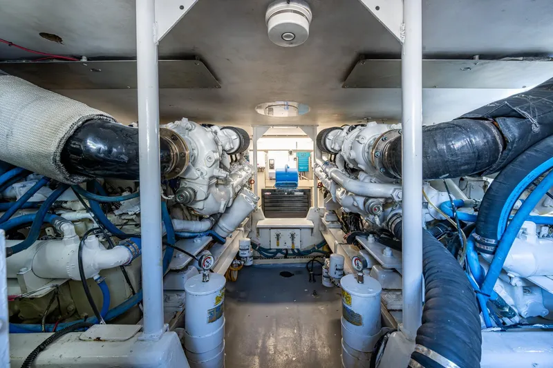 Slide: The Image of Engine room of 1998 Viking 50 Convertible yacht, showcasing dual engines and mechanical systems. - 44