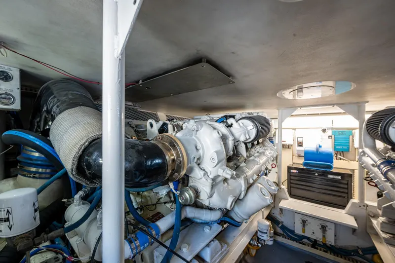 Slide: The Image of Engine room of a 1998 Viking 50 Convertible yacht, showcasing machinery and components. - 46
