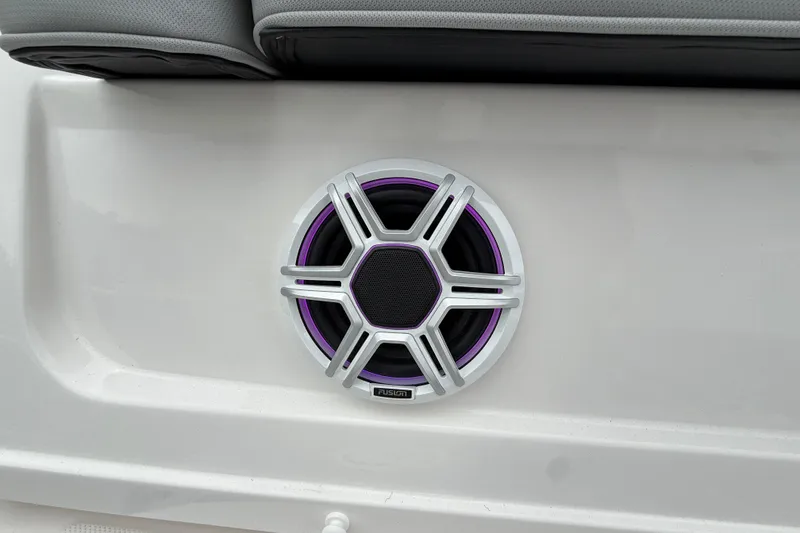 Slide: The Image of 2026 Regal 36 Grande Coupe speaker with purple accents and cushioned seating. - 10