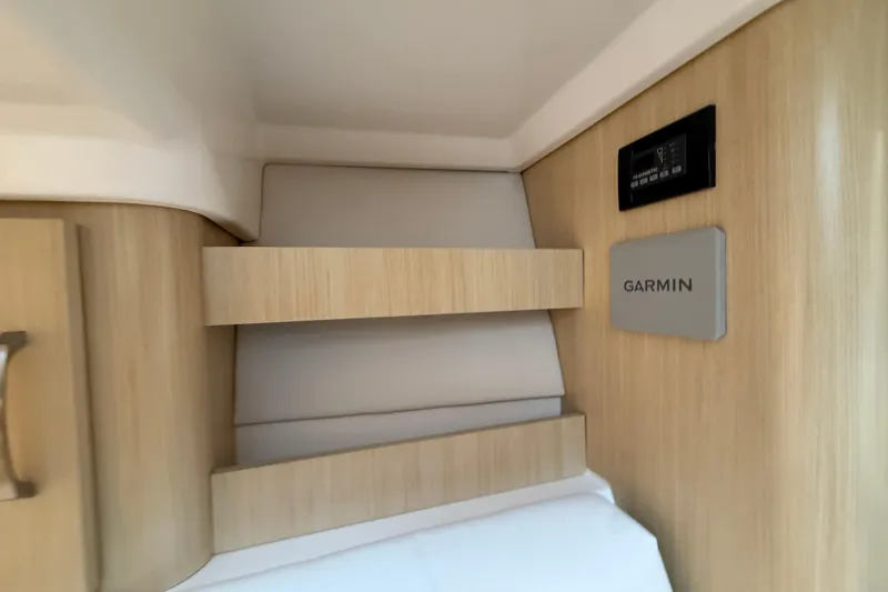 Slide: The Image of Interior of 2026 Regal 36 Grande Coupe featuring Garmin technology and modern wood finish. - 103