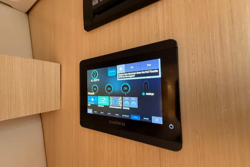 Slide: The Image of Touchscreen control panel on 2026 Regal 36 Grande Coupe yacht interior. - 104