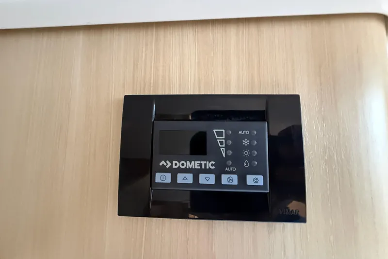 Slide: The Image of Dometic control panel on 2026 Regal 36 Grande Coupe yacht interior. - 105